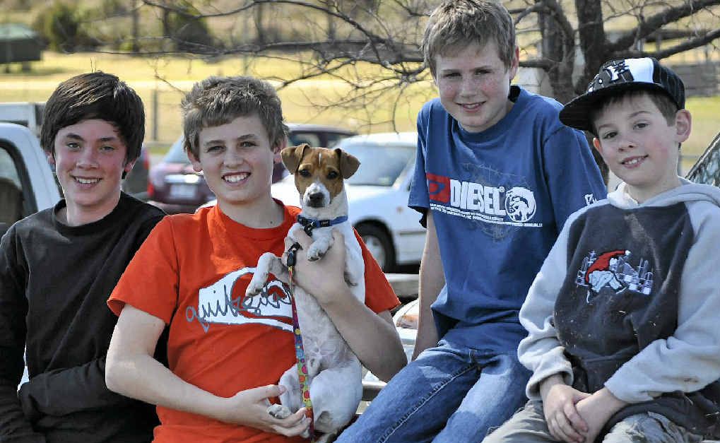 Will Gotze, Lachlan Farmer, Campbell Farmer, Dylan Locke and Rusty the dog enjoy the sunshine at the footy semi-finals at the weekend.